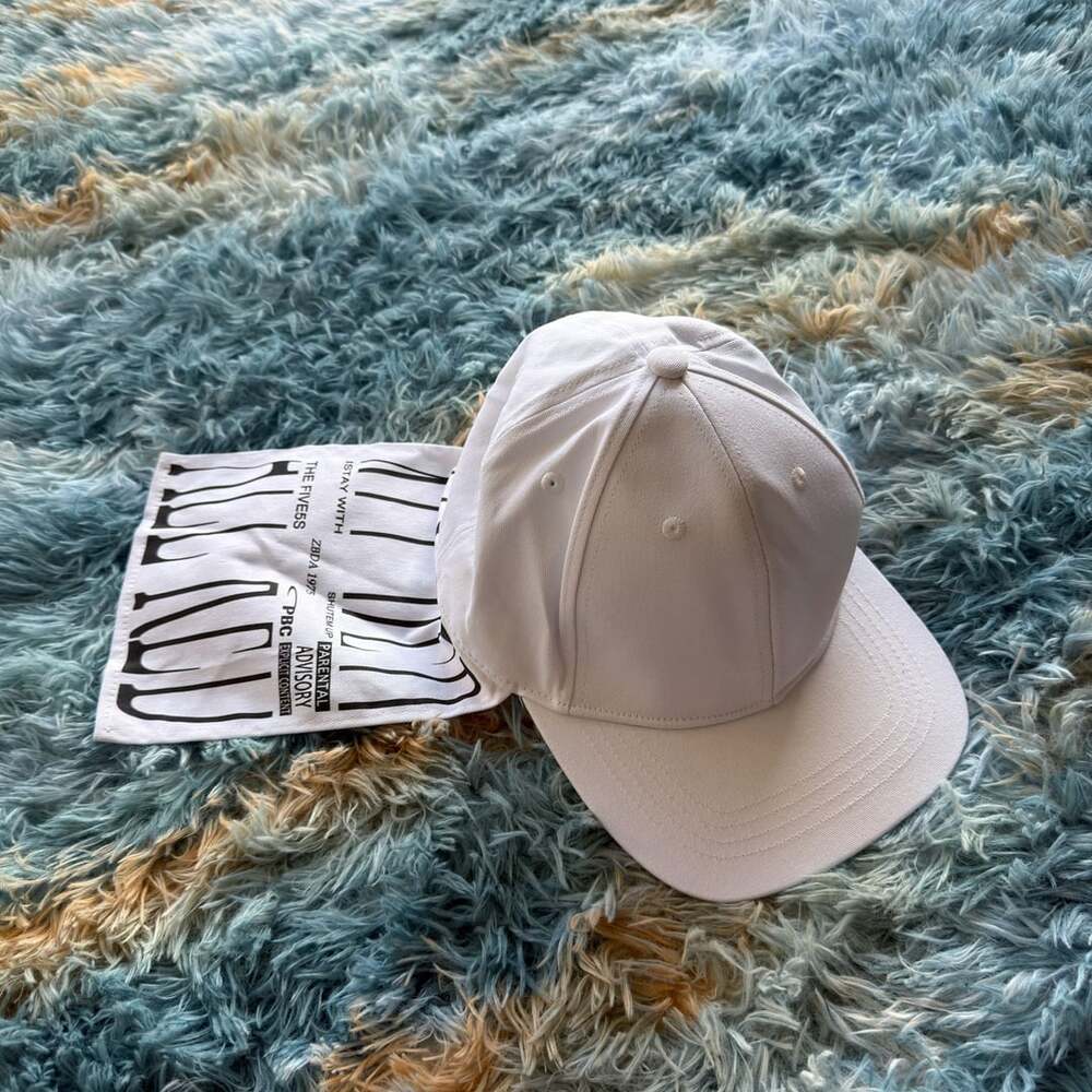 Playboi Carti YVL White Cap hat with Flap Tail hanging